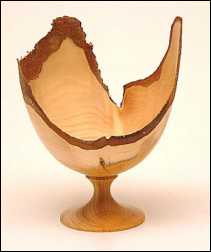 Yew goblet with natural edge.